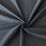 The Luxe Cotton Sateen Flat Sheet - Charcoal from Linenly features smooth, dark gray fabric twisted into a spiral with soft folds. Crafted from 100% cotton sateen, it offers a silky, glossy texture and elegant sheen.