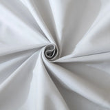 A close-up of the Linenly Luxe Cotton Sateen Flat Sheet in Silver, neatly twisted into a spiral with smooth, soft folds and a gently matte texture radiating from the center.